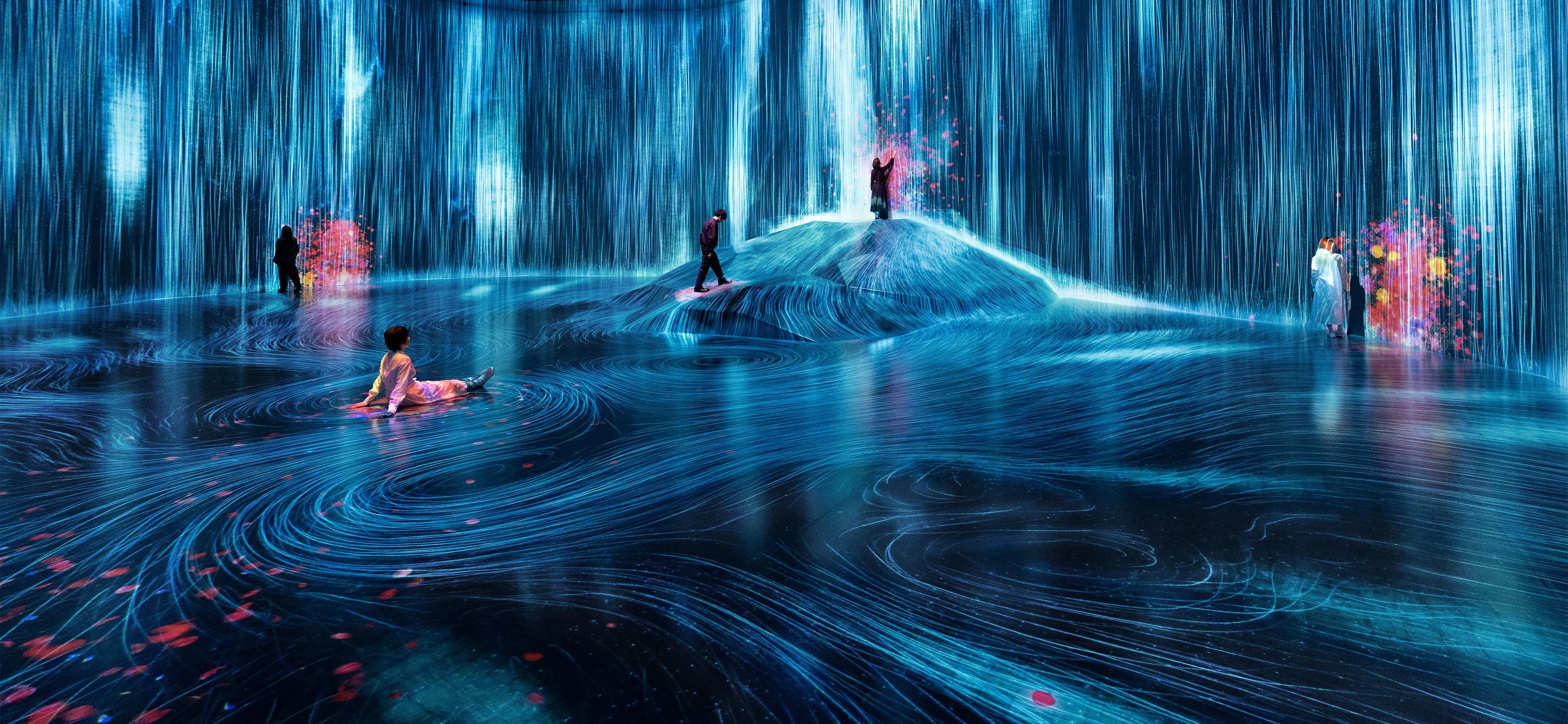在人们聚集的岩石上，注入水粒子的世界 / Universe of Water Particles on a Rock where People ...