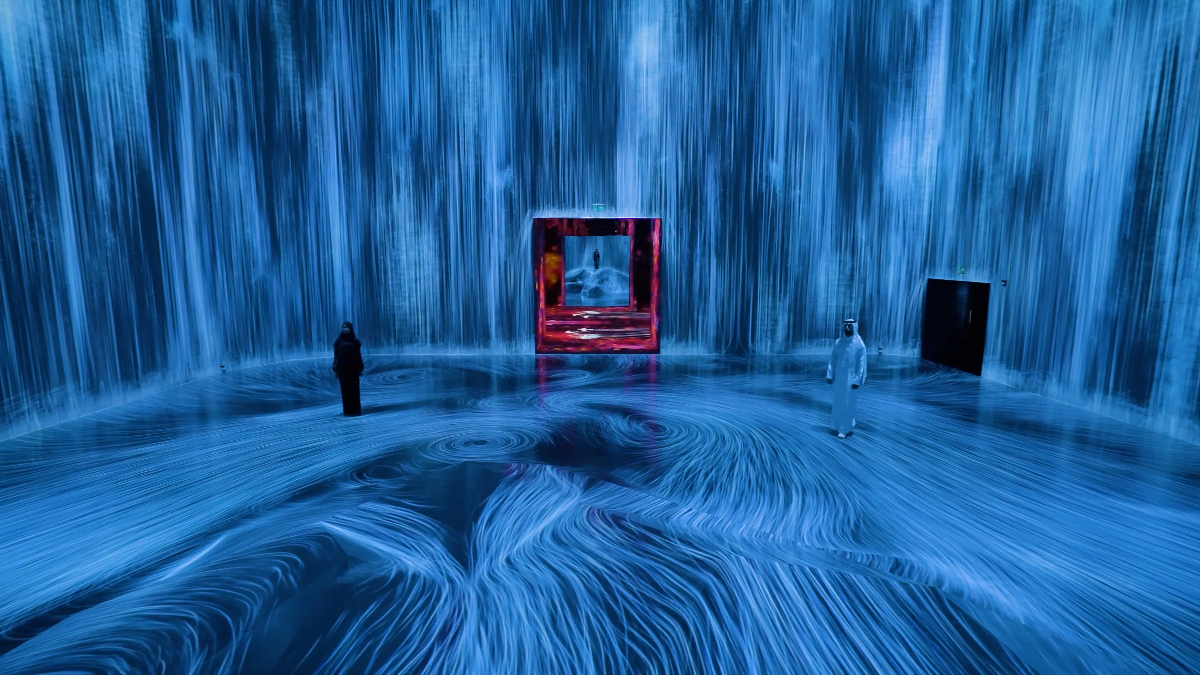 Universe of Water Particles on a Rock where People Gather | teamLab